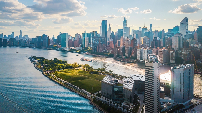 Aerial of Roosevelt Island and Four Freedoms state park downtown Manhattan on a cloudy day.
