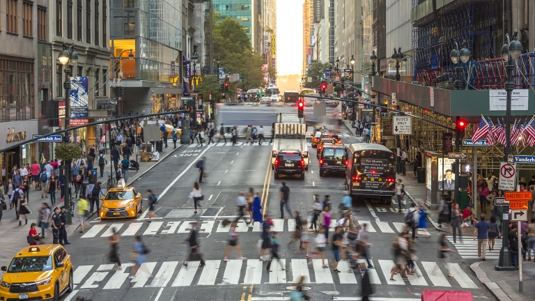 Pedestrians, commuters, and traffic on 42nd Street in Midtown Manhattan, New York City, U.S.A.