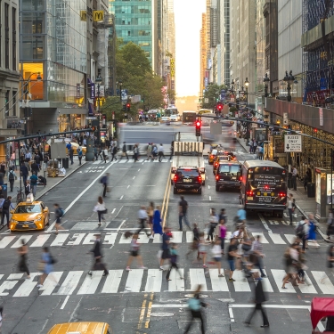 Pedestrians, commuters, and traffic on 42nd Street in Midtown Manhattan, New York City, U.S.A.